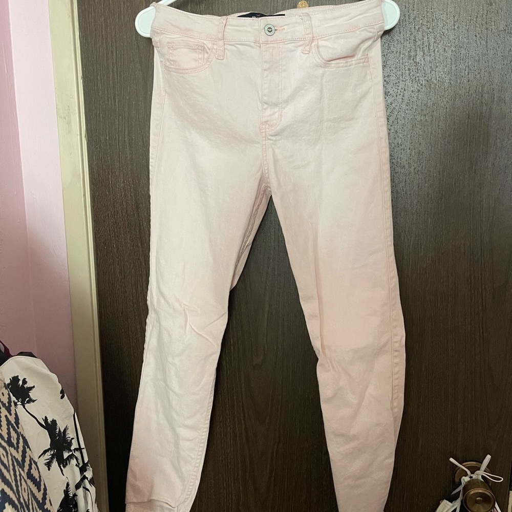 Hollister size 27 / 5 high rise crop skinny jeans. Color is light pink.
